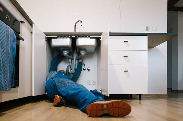 Professional Drain Cleaning technician working in Newport, AR